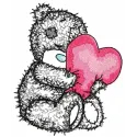 Teddy bear holding a heart-shaped pillow, showcasing a cute applique embroidery design for creative projects.