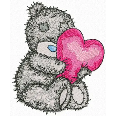 Teddy bear holding a heart-shaped pillow embroidery design, ideal for embellishing baby onesies and blankets.