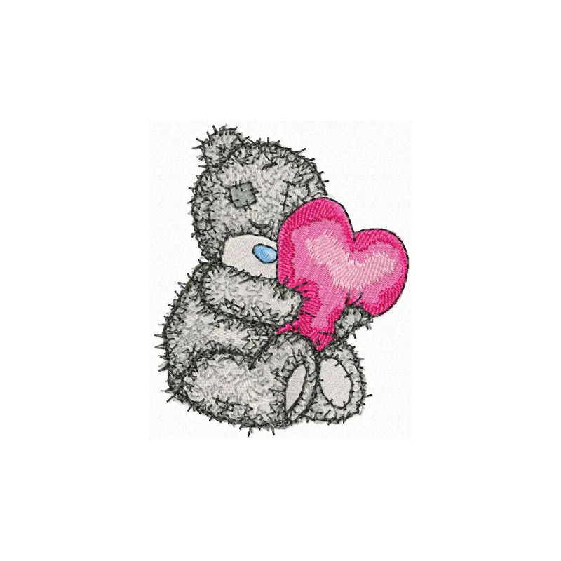 Teddy bear holding a heart-shaped pillow embroidery design, ideal for embellishing baby onesies and blankets.