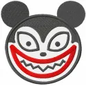 Smiling vampire teddy bear embroidery design with stitched details and playful expression