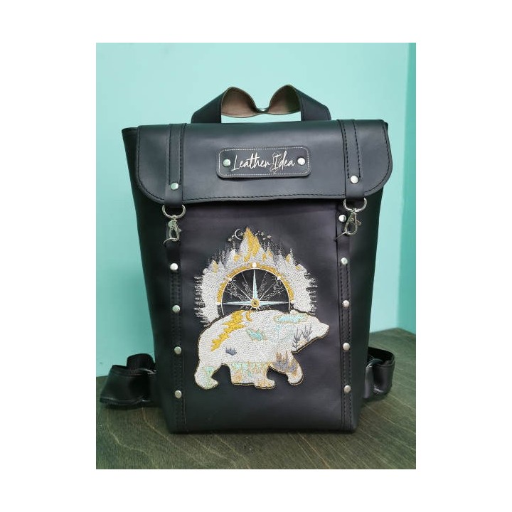 Backpack with embroidered bear design