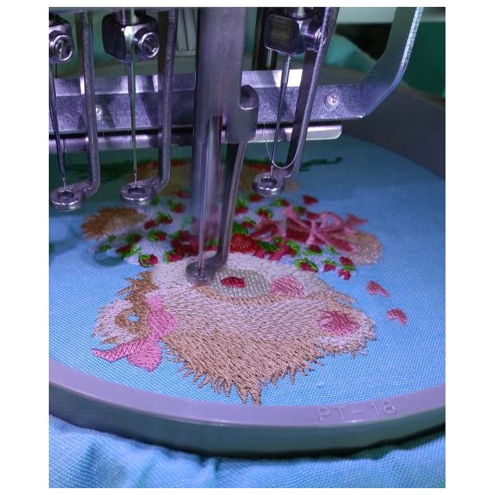 embroidering process cute teddy bear design