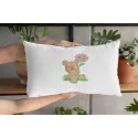 Cushion with bear botanist embroidery design featuring a teddy bear with plants and tools, perfect for crafting projects.