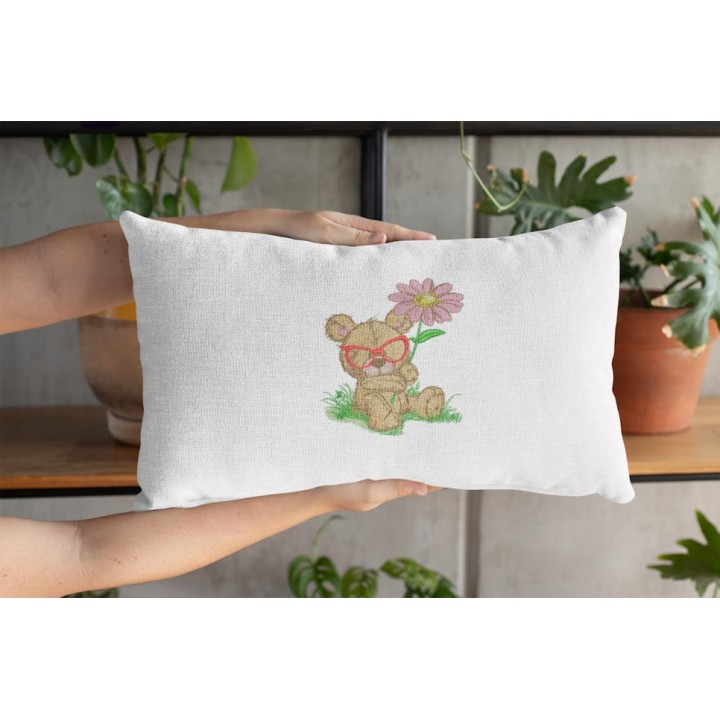 Cushion with bear botanist embroidery design featuring a teddy bear with plants and tools, perfect for crafting projects.
