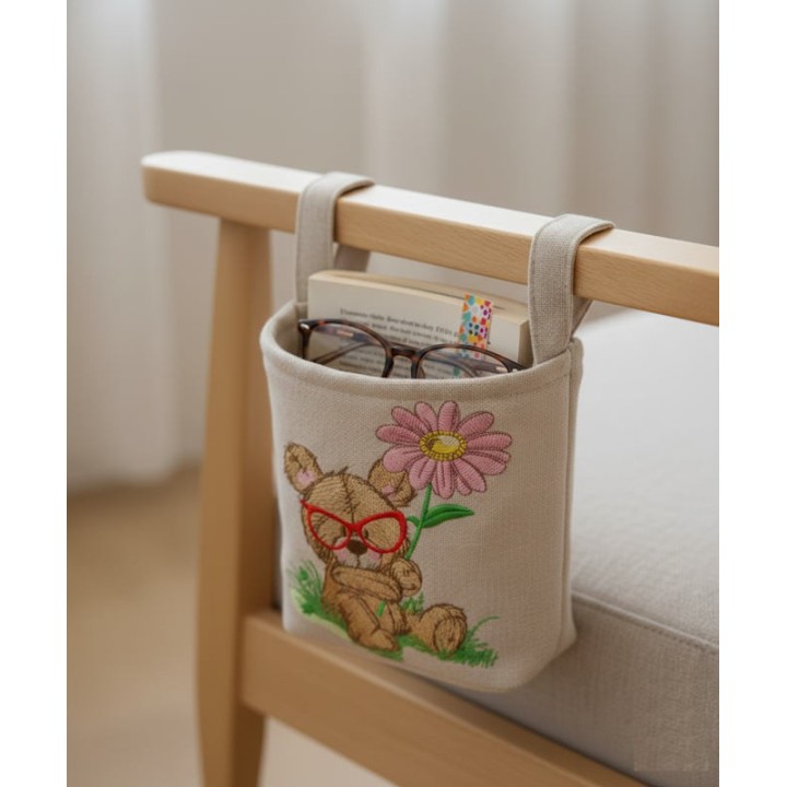 Detailed bear botanist embroidery design featuring a teddy bear surrounded by plants and flowers.