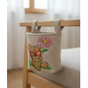 Intricat botanist embroidery design showcasing a teddy bear surrounded by plants and flowers.