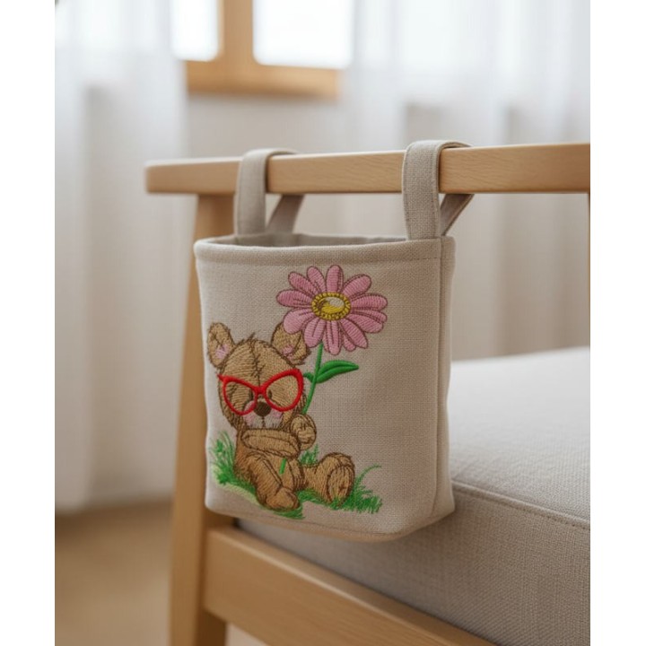 Intricat botanist embroidery design showcasing a teddy bear surrounded by plants and flowers.