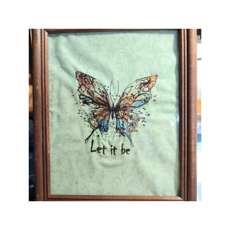 Closeup of Butterfly Let It Be embroidery design featuring intricate stitching patterns for embellishing fabrics.