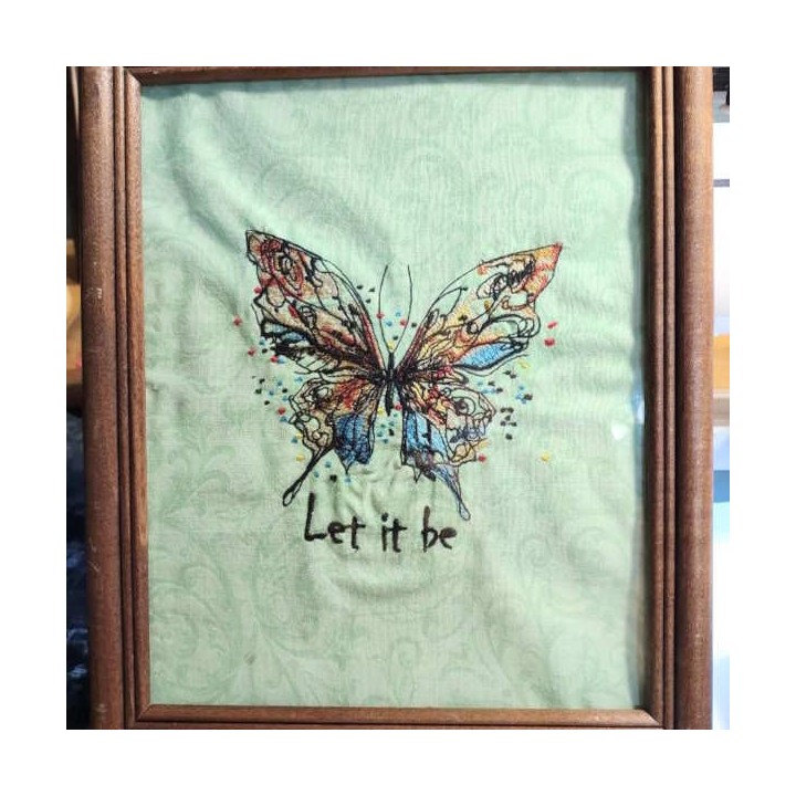 Closeup of Butterfly Let It Be embroidery design featuring intricate stitching patterns for embellishing fabrics.