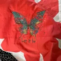 Butterfly 'Let It Be' embroidery design showcasing a colorful butterfly motif for creative stitching projects.