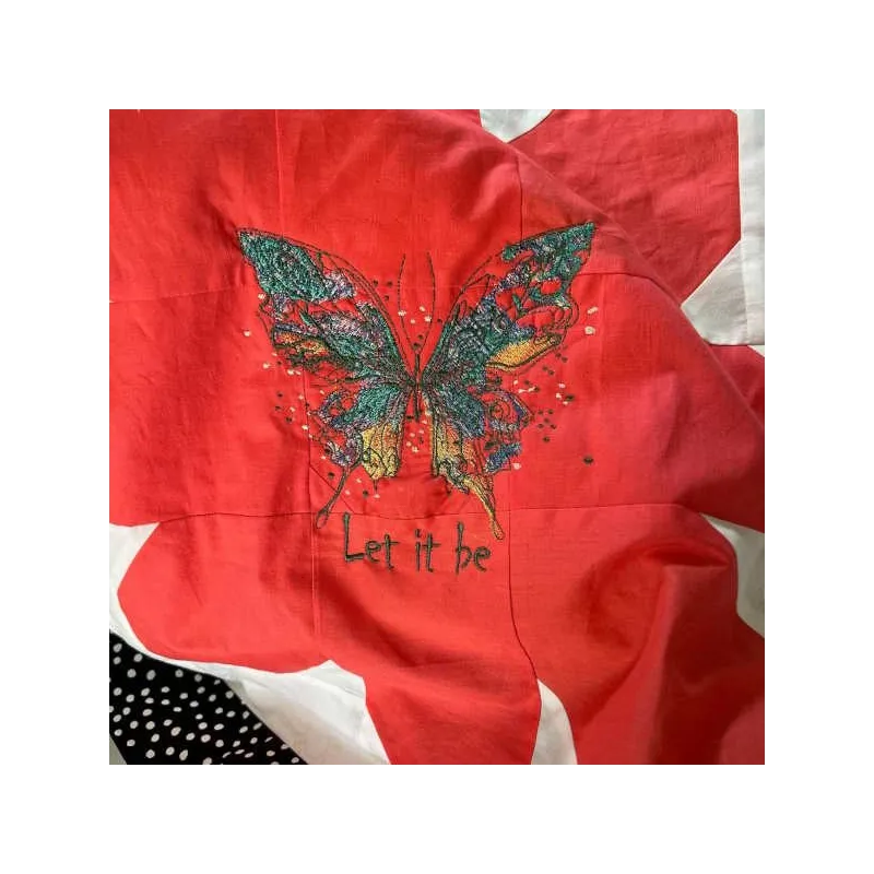 Butterfly 'Let It Be' embroidery design showcasing a colorful butterfly motif for creative stitching projects.
