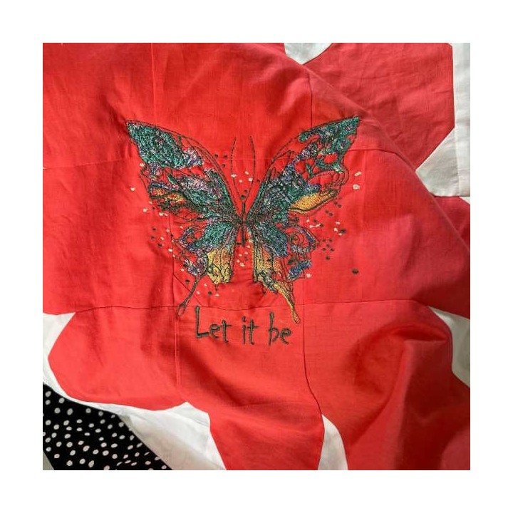 Butterfly 'Let It Be' embroidery design showcasing a colorful butterfly motif for creative stitching projects.
