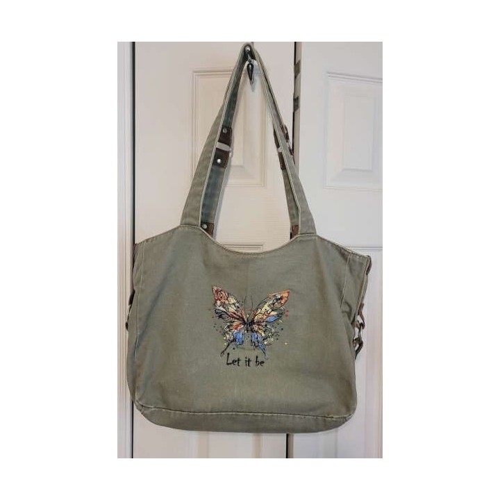 Preview of the Butterfly 'Let It Be' embroidery design, showcasing intricate stitching patterns ideal for various fabrics.