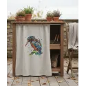 Bright birdie embroidery design showcased on a fabric surface, featuring colorful stitching patterns of a cheerful bird.