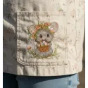 Closeup of an Easter mouse embroidery design featuring a mouse with a basket of colorful eggs.