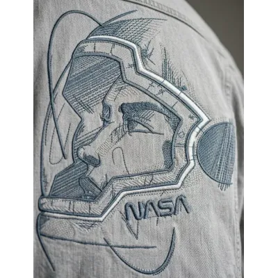 Closeup of an astronaut in a helmet embroidery design from the Fantastic World collection.
