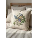 Embroidery design of blue tits perched on an apple tree, showcasing intricate stitching patterns.