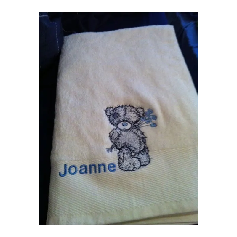 Teddy Bear with blue flower embroidery design - Embroidery Design