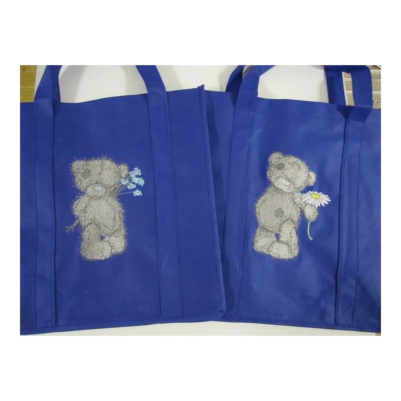 Teddy Bear with blue flower embroidery design - Embroidery Design