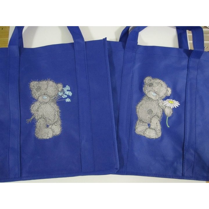 Teddy Bear with blue flower embroidery design - Embroidery Design