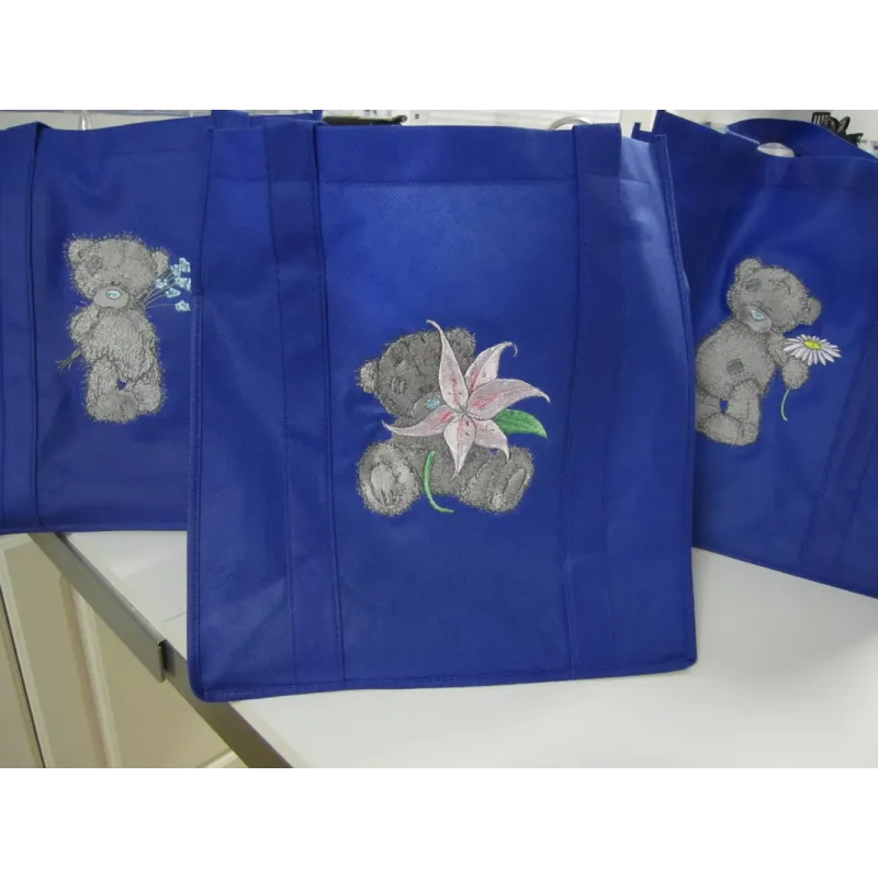 Teddy Bear with blue flower embroidery design - Embroidery Design