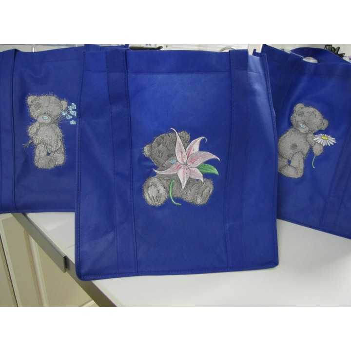 Teddy Bear with blue flower embroidery design - Embroidery Design