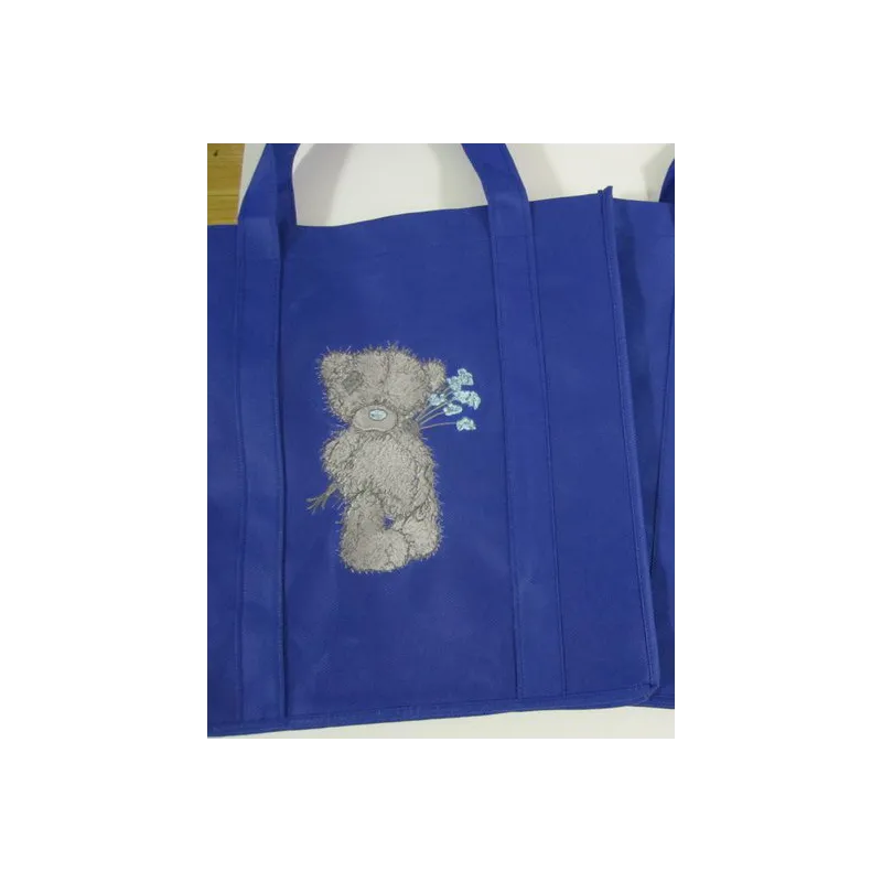Teddy Bear with blue flower embroidery design - Embroidery Design