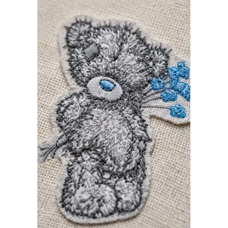 Teddy Bear with blue flower embroidery design - Embroidery Design