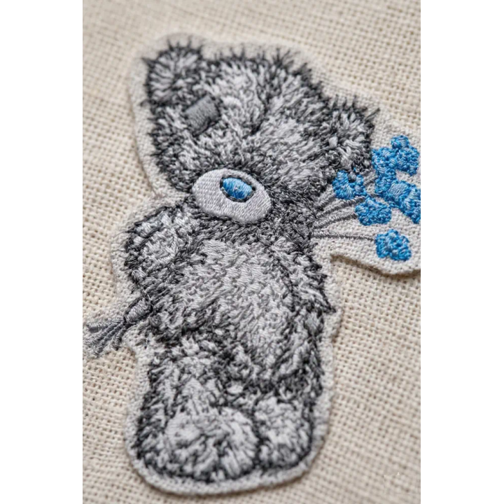 Teddy Bear with blue flower embroidery design - Embroidery Design