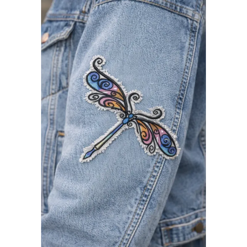 Closeup of a delicate dragonfly embroidery design showcasing intricate stitching patterns for creative projects.