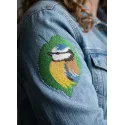 Tree leaf with birdie embroidery design showcasing a delicate bird perched on a leaf, ideal for various fabric projects.
