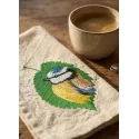 Embroidery design featuring a tree leaf with a birdie, ideal for stitching on t-shirts or tote bags.