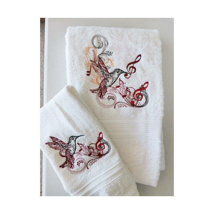 Closeup of a musical hummingbird embroidery design showcasing intricate stitching patterns.