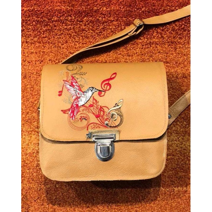 Detailed preview of a musical hummingbird embroidery design, showcasing intricate stitching patterns for bird lovers.