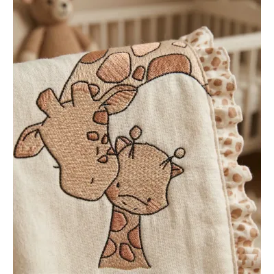 Closeup of the Giraffe Kiss baby giraffe embroidery design, showcasing charming stitched motifs for baby items.