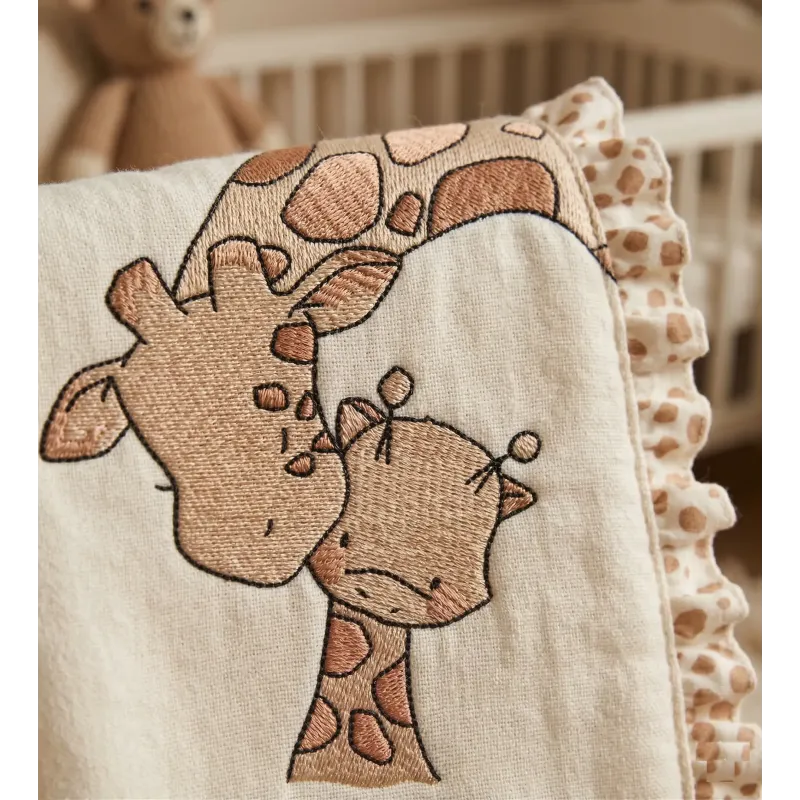 Closeup of the Giraffe Kiss baby giraffe embroidery design, showcasing charming stitched motifs for baby items.