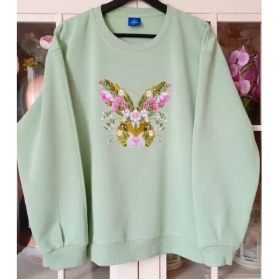 Closeup of Floral Easter Bunny embroidery design showcasing intricate stitching patterns and vibrant floral details.