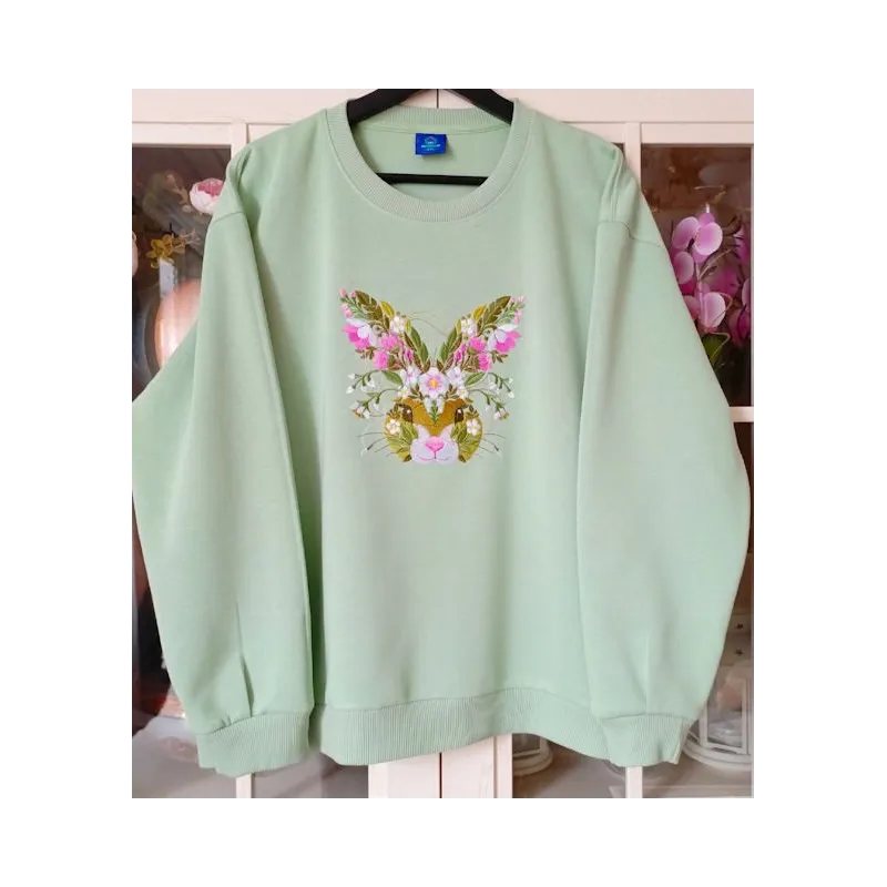 Closeup of Floral Easter Bunny embroidery design showcasing intricate stitching patterns and vibrant floral details.