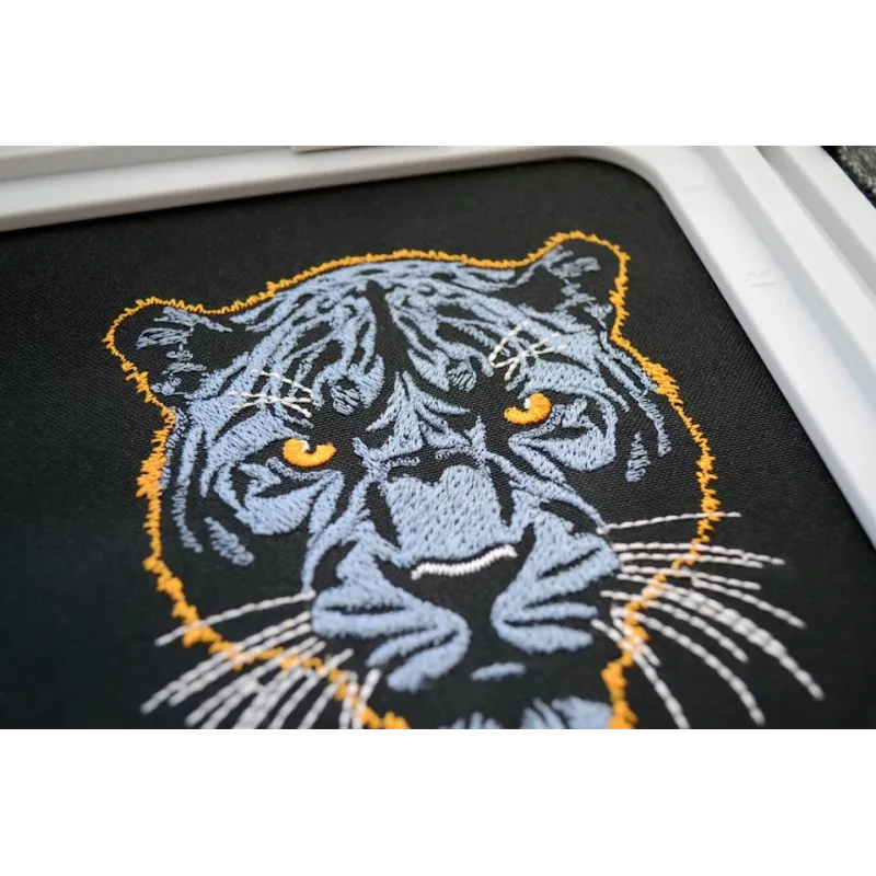 Dark blue panther embroidery design showcased on a dark background, perfect for embellishing t-shirts and hoodies.