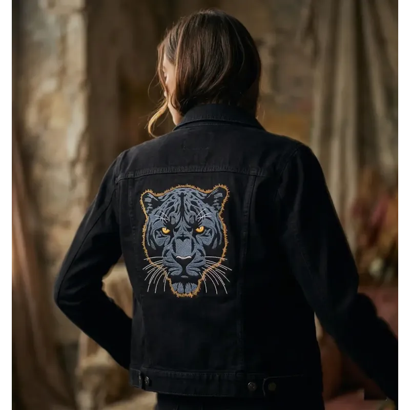 Dark blue panther embroidery design on a dark background, showcasing intricate stitching patterns for creative projects.