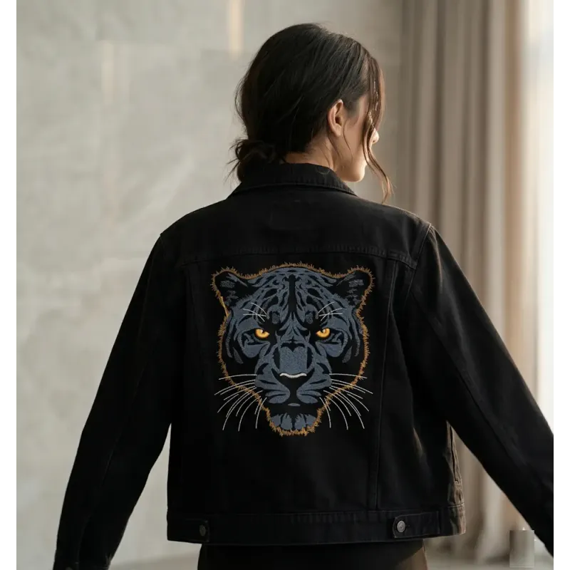Dark blue panther embroidery design on a dark background, showcasing intricate stitching patterns.