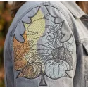 Closeup of an autumn leaf landscape embroidery design, showcasing intricate details for fall-themed stitching projects.