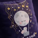 Closeup of a bunny in a hot air balloon embroidery design against a night sky, perfect for baby items.