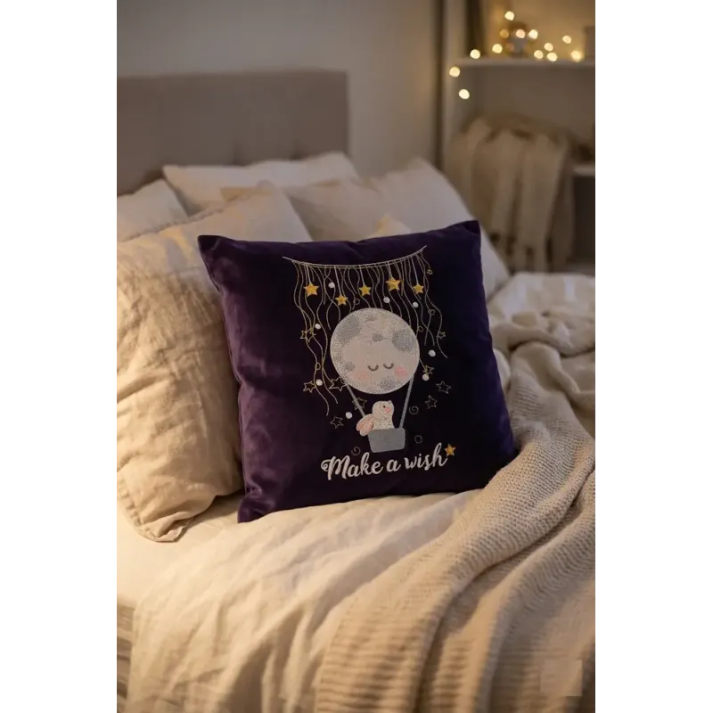 Embroidery design of a bunny in a hot air balloon floating in a night sky, perfect for baby items.