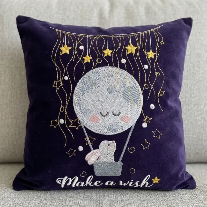 Bunny in a hot air balloon in the night sky embroidery design, ideal for baby apparel and nursery decor.