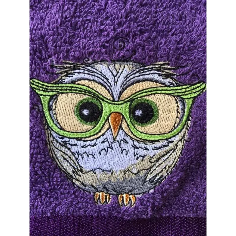 Owl wearing glasses embroidery design preview showing stitched details