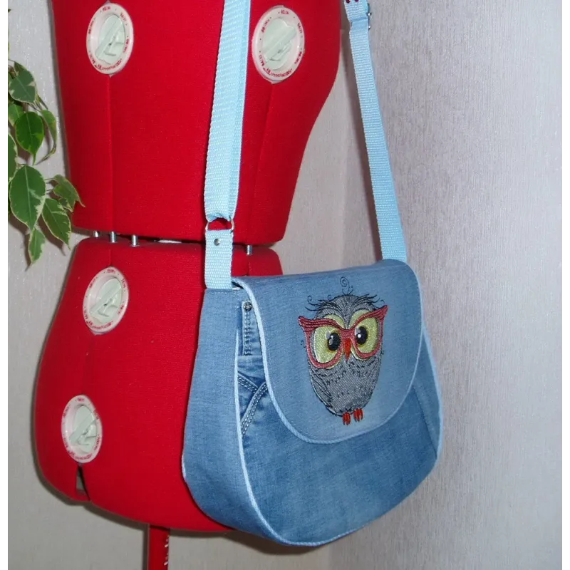 Owl wearing glasses embroidery design preview showing stitched detail