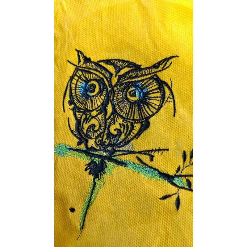 Strange owl 12 embroidery design closeup showing detailed stitching pattern