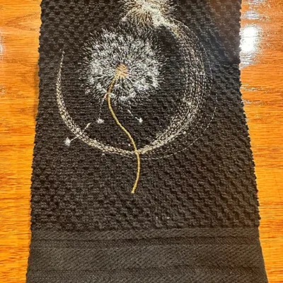 Fairy magic dandelion embroidery design featuring whimsical fairy with flowing wings among delicate dandelion seeds