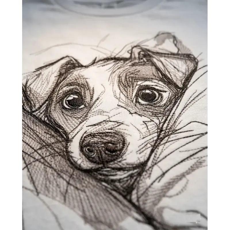 Puppy in the bosom embroidery design preview showing detailed stitching pattern